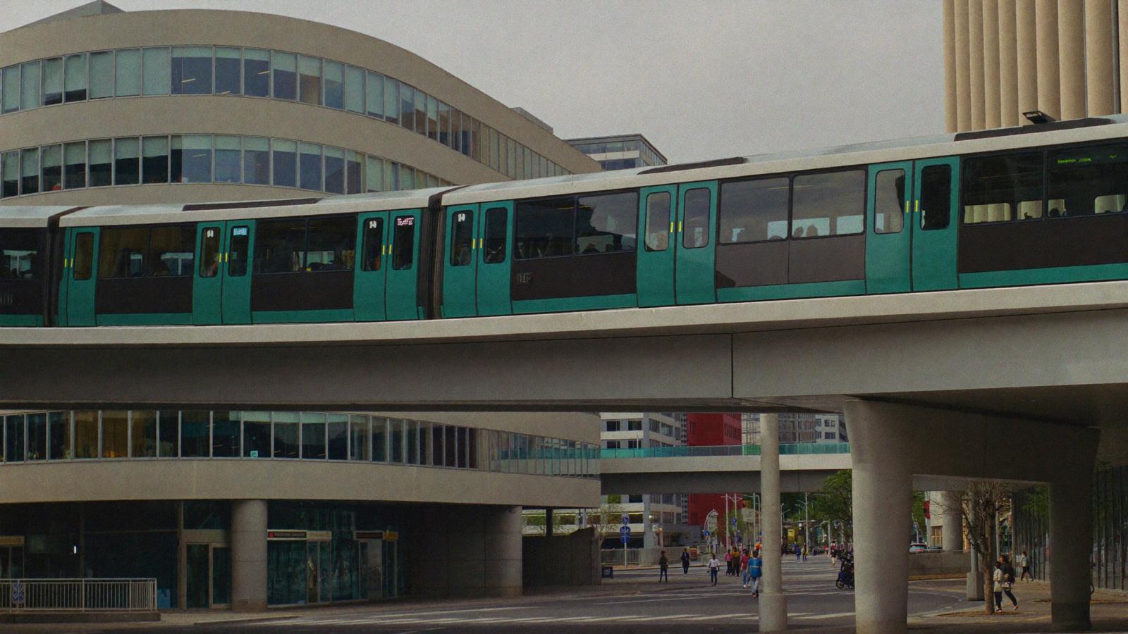 A futuristic city plaza with elevated monorail tracks and pedestrians.